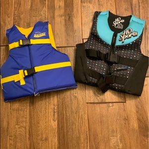 Youth life vest. Both fit 50-90 lbs.